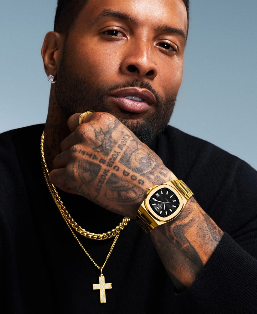 Odell Beckham Jr. wearing a gold JAXXON watch and gold chains