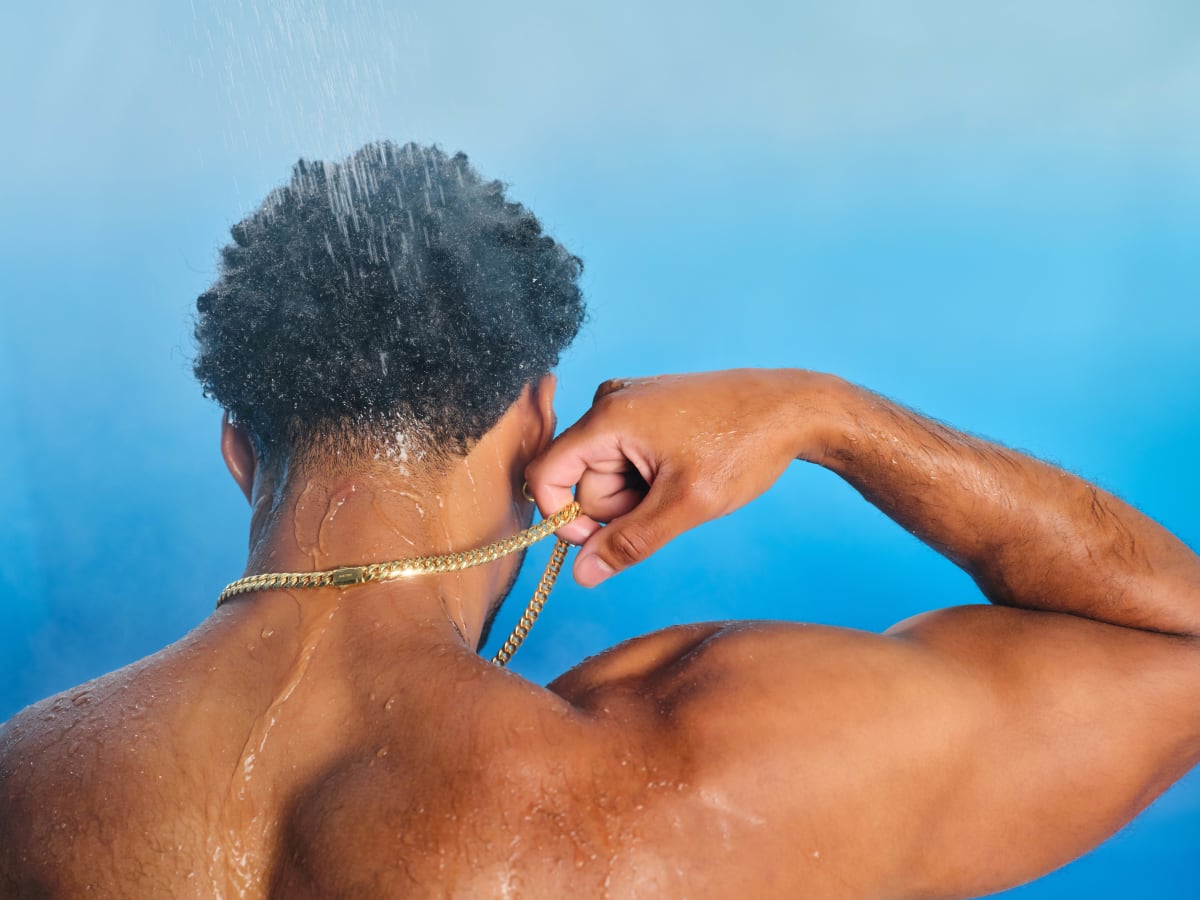 Man wearing the gold Cuban Link Chain in the shower