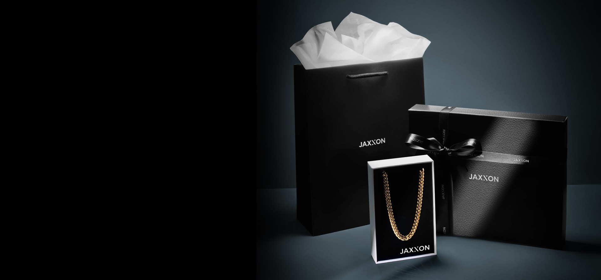 JAXXON gift box and bag with a gold Cuban Link Chain in signature packaging